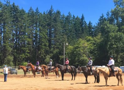 Riders lined up at a horse show