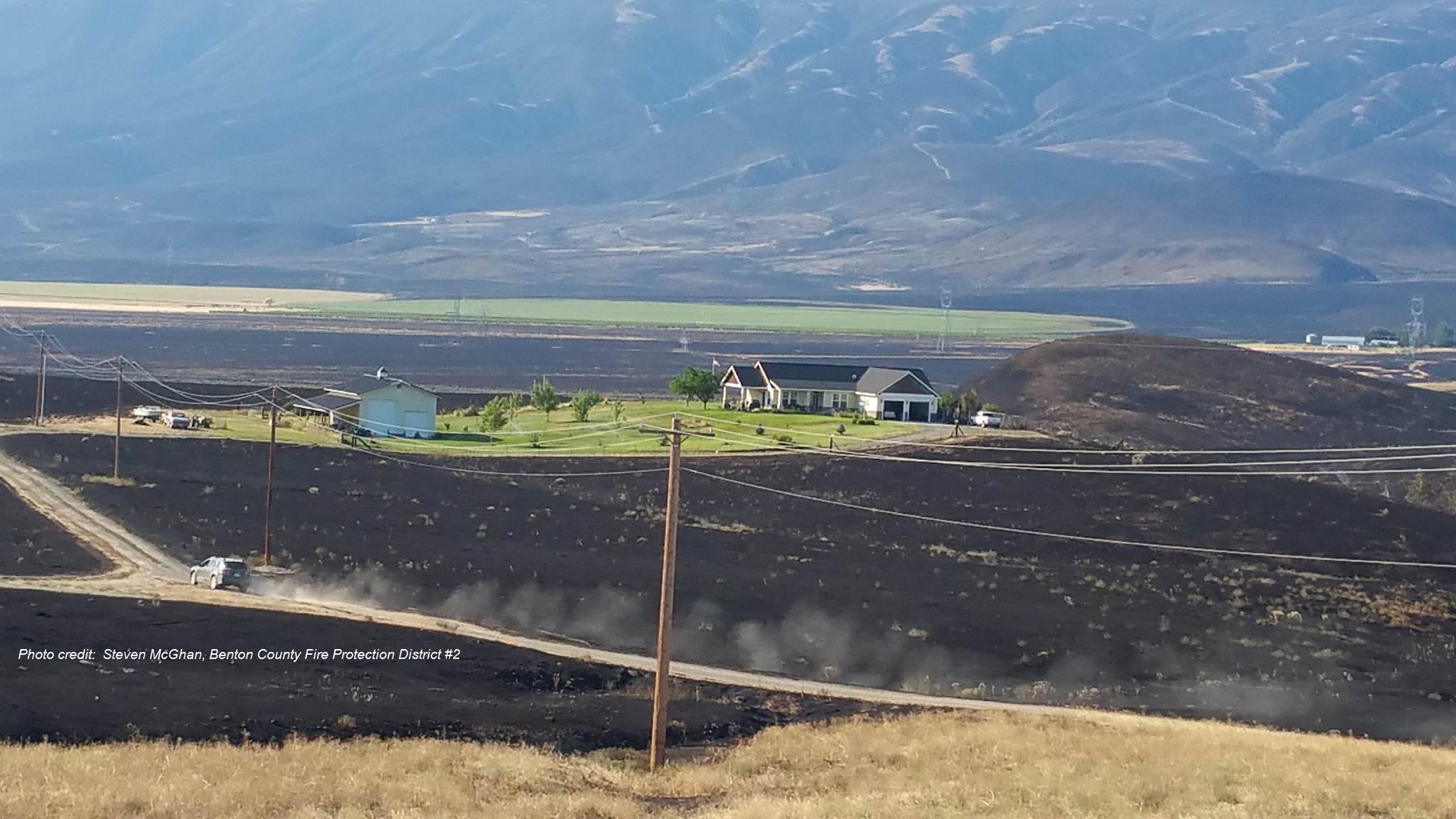 fire scorched landscape around a house