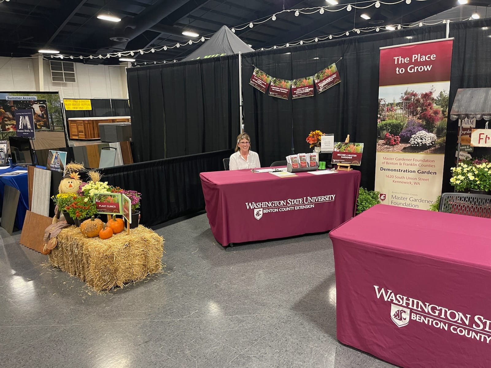 Master Gardener volunteer at the fair booth ready to answer your gardening questions