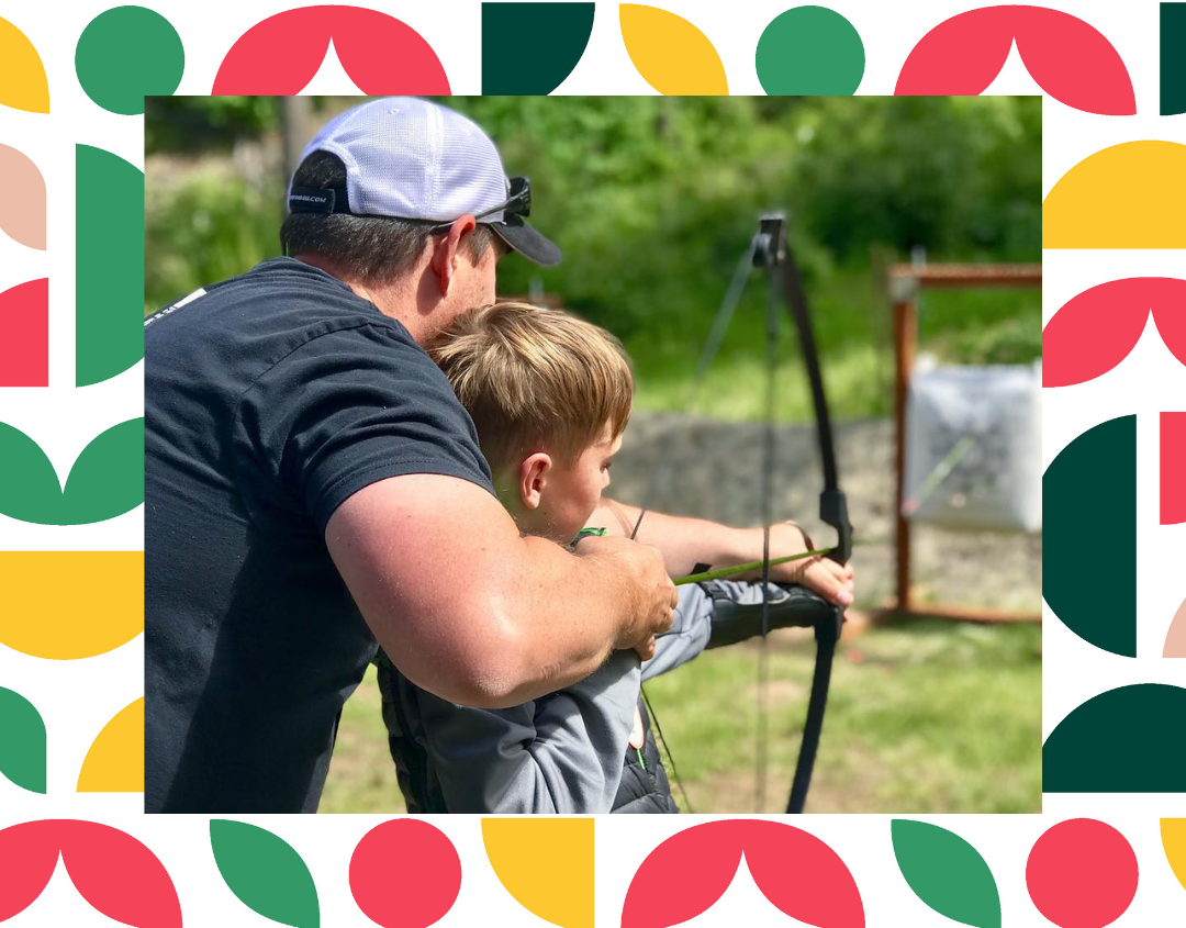 4-H youth learning archery with their volunteer leader