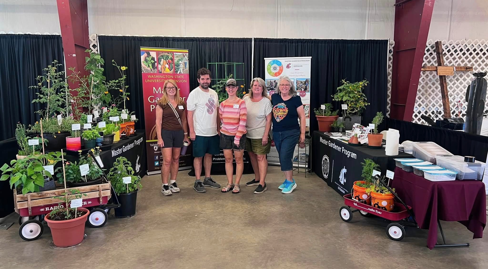 Master Gardener volunteers help set up the Benton Franklin Fair booth