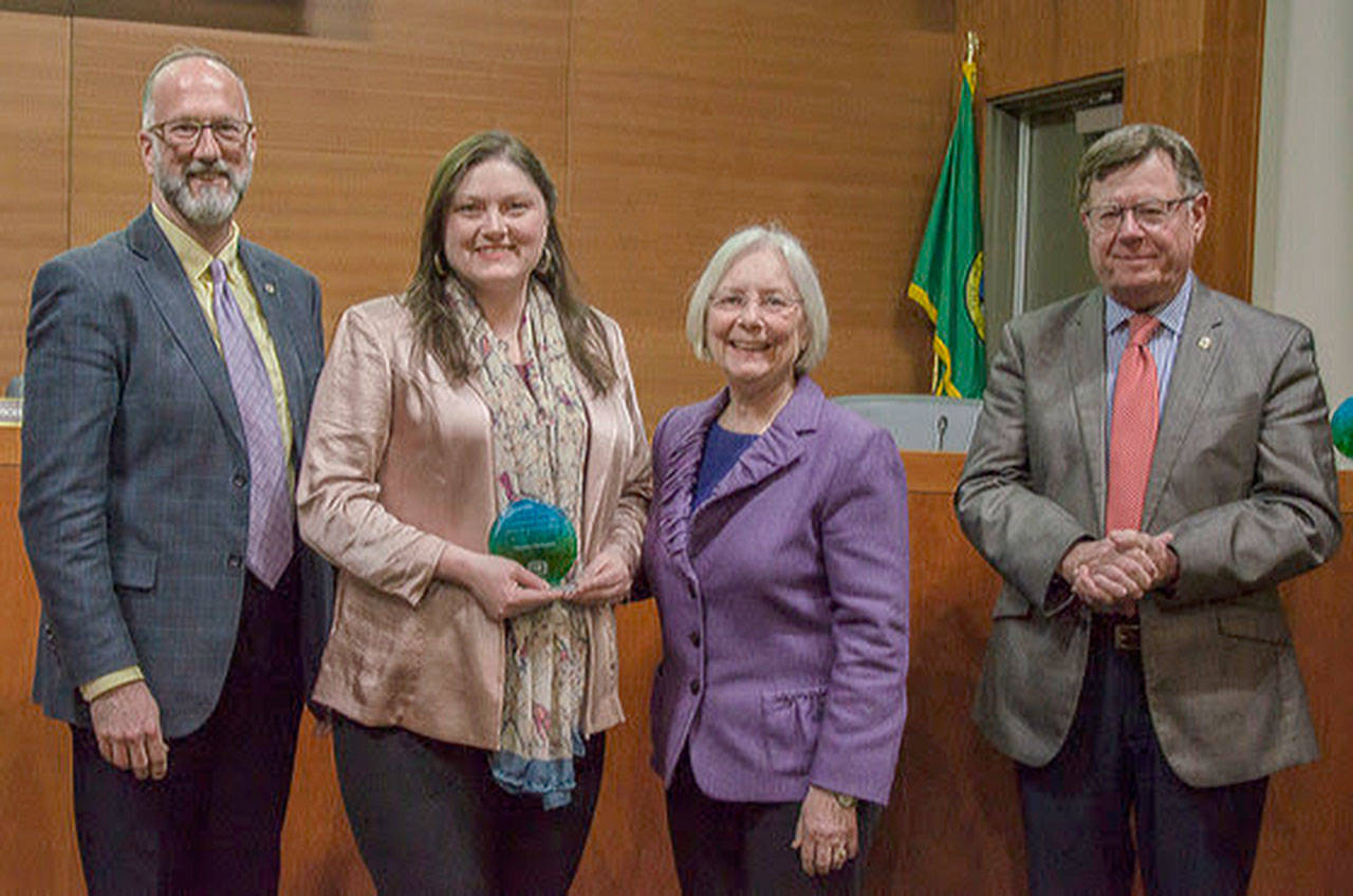 Paisley Gallagher with Commissioner Garrido receiving an award