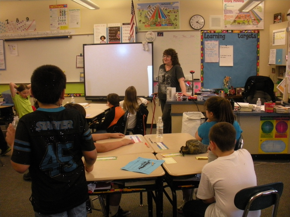 children in a classroom at there desks learning