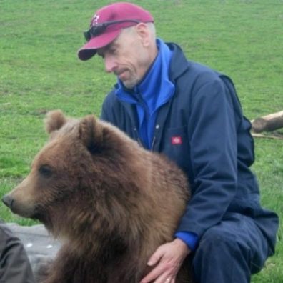 Dr. Charlie Robbins with a bear.