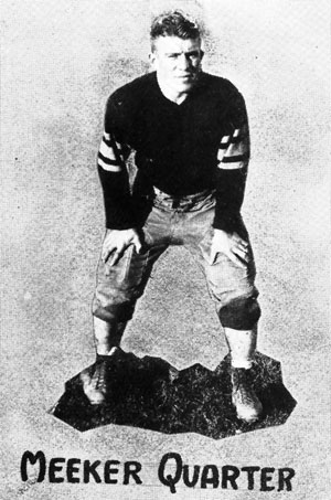 Black and white archival image of Herbert "Butch" Meeker in his football uniform.
