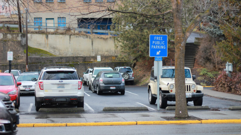 An image of a City of Pullman free public parking lot and sign in downtown.