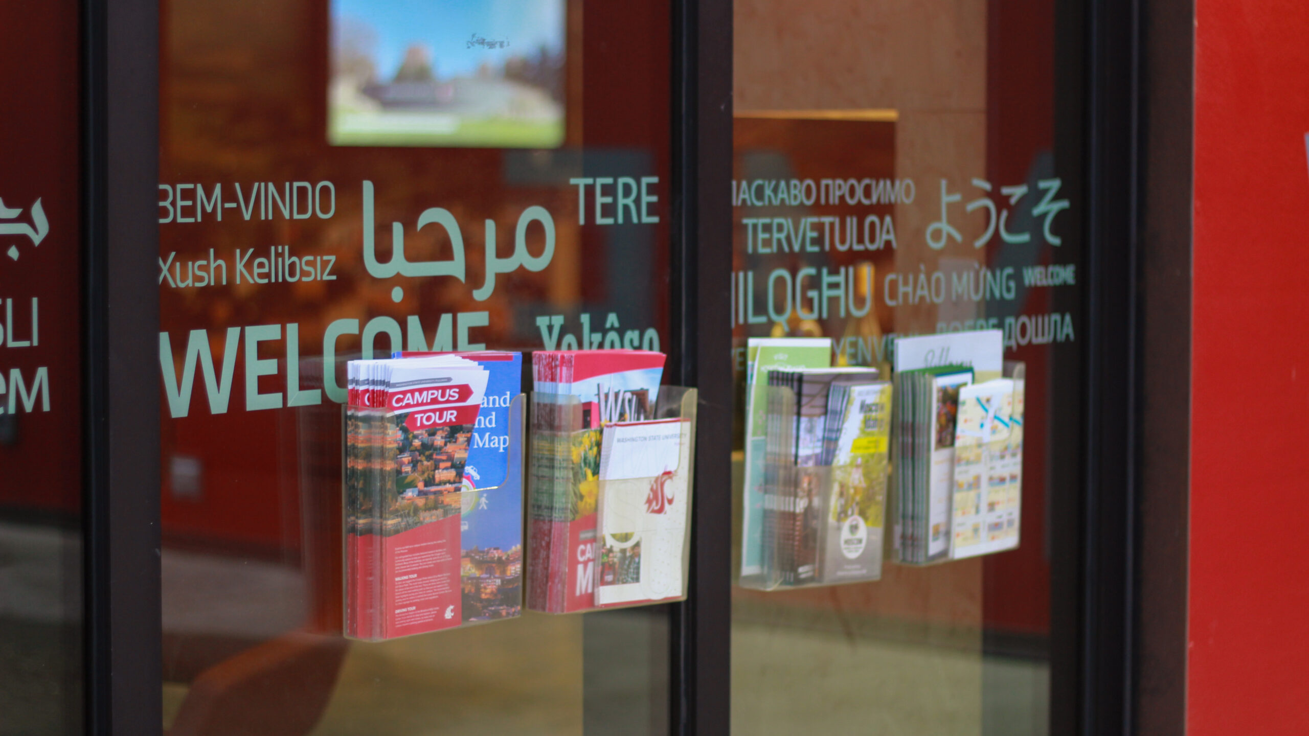 An image of brochure racks outside the Brelsford Washington State University Visitor Center in Pullman, Washington.