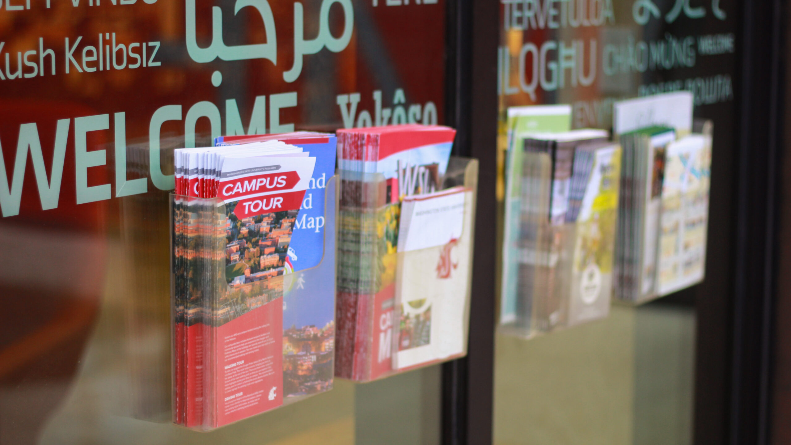 An image of brochure racks outside the Brelsford Washington State University Visitor Center in Pullman, Washington.