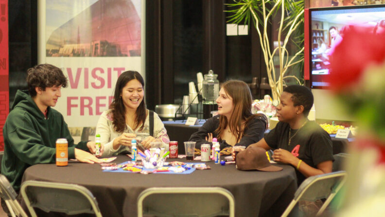 An image of four individuals playing Bingo during an event at the Brelsford Washington State University Visitor Center in Pullman, Washington.