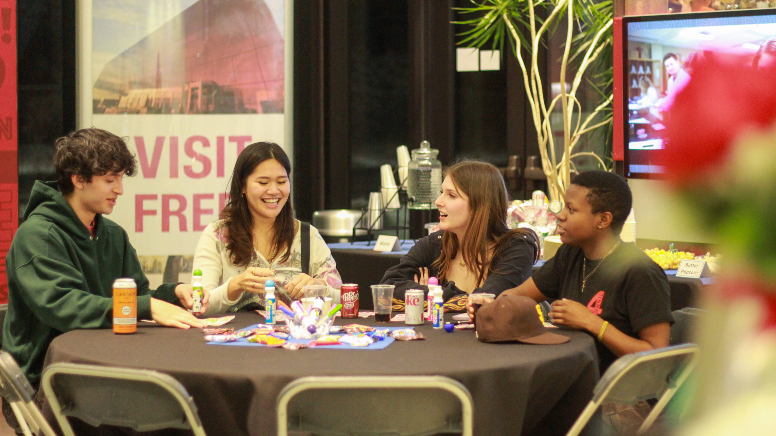 Group of 4 people at a round table playing BINGO at WSU Visitor Center