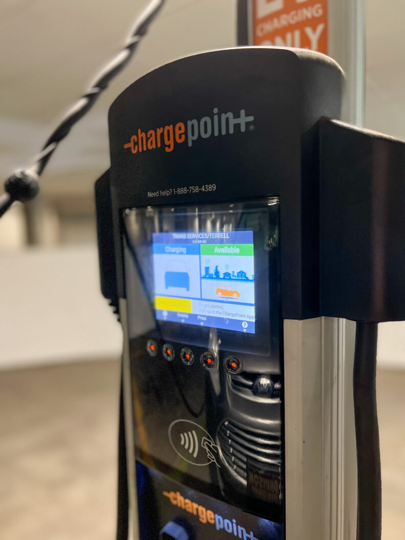 An image of an electric vehicle charging station inside a parking garage at Washington State University Pullman.