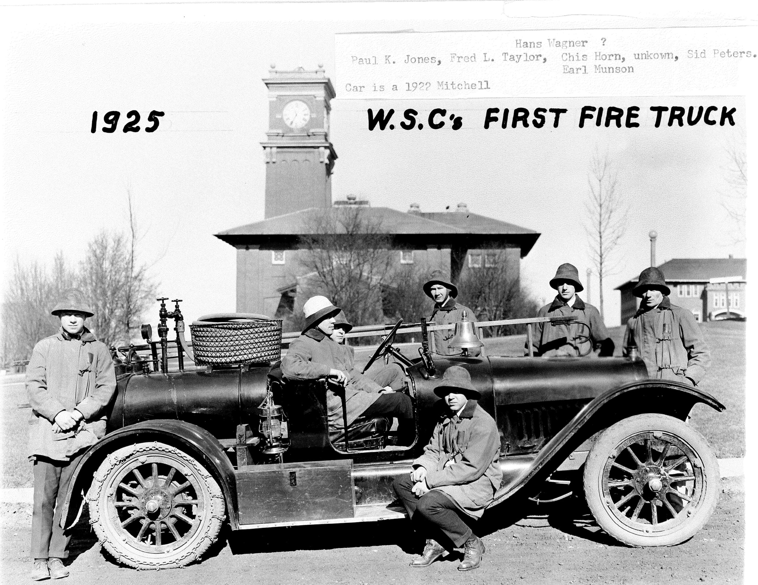 picture of W.S.C.'s first fire truck from 1925 with fire fighters