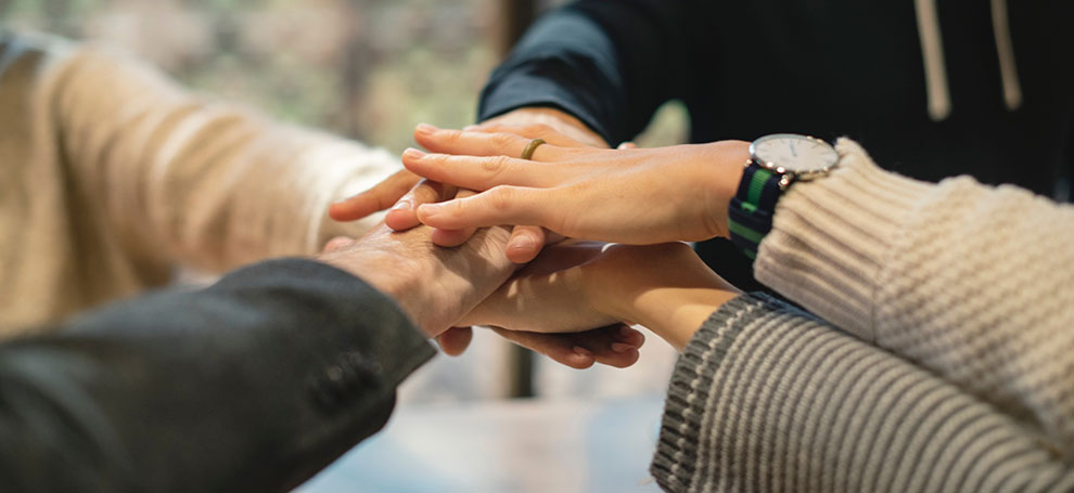Stock image of team huddle