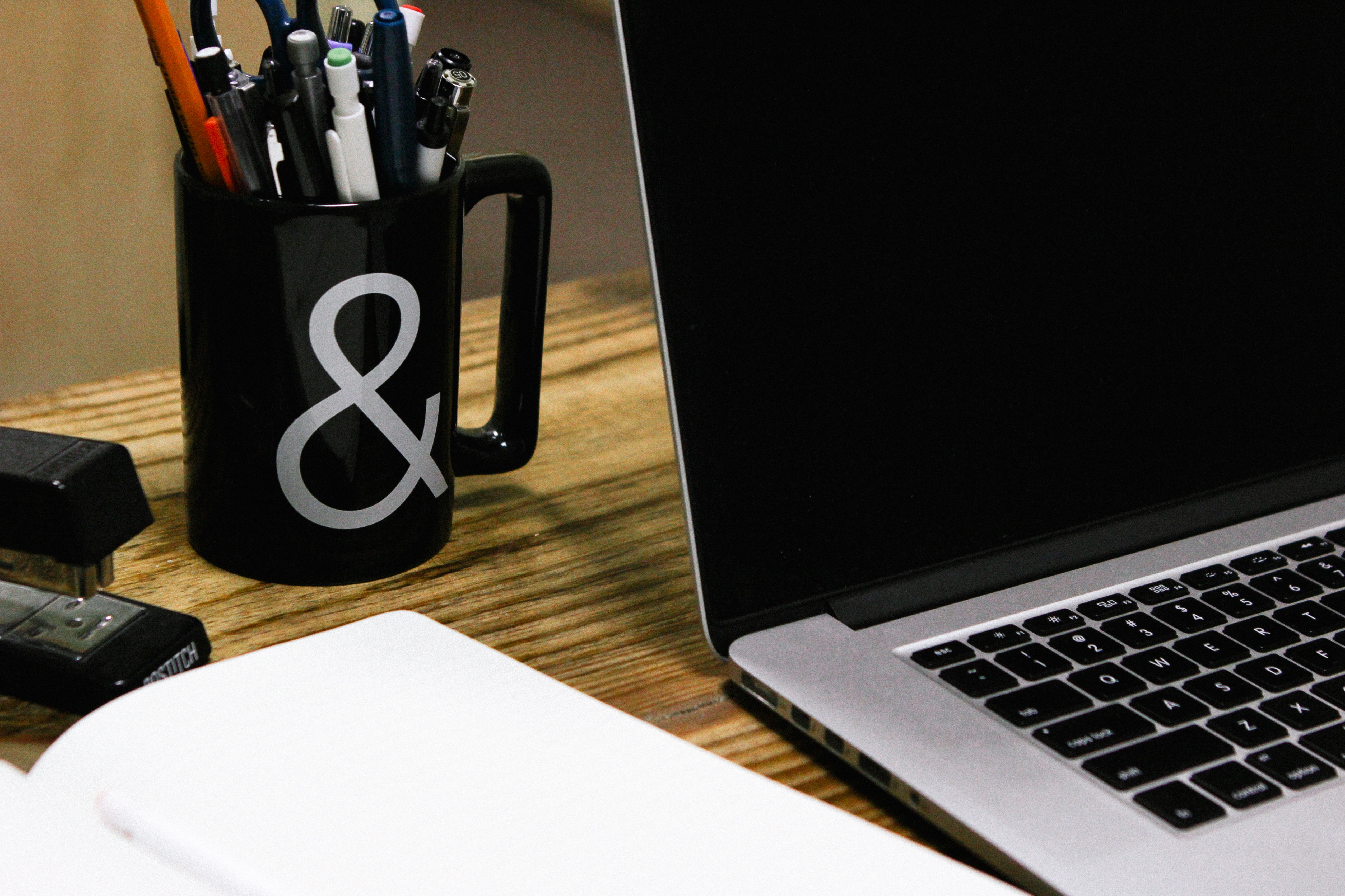 desk supplies and laptop