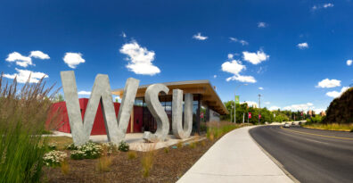 Outside view of WSU Brelsford Visitor Center on the Pullman Campus during summer.