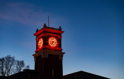 Bryan Hall Clock Tower lit up at night.