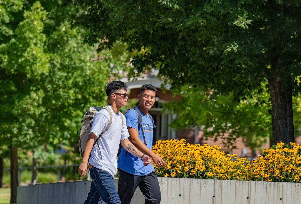 Two students walking outside on the first day of fall classes