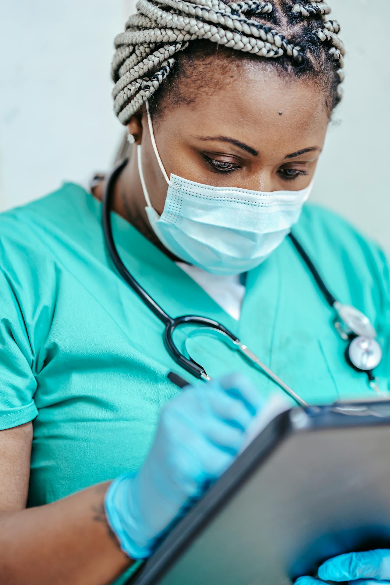 A nurse looks over a patient record.