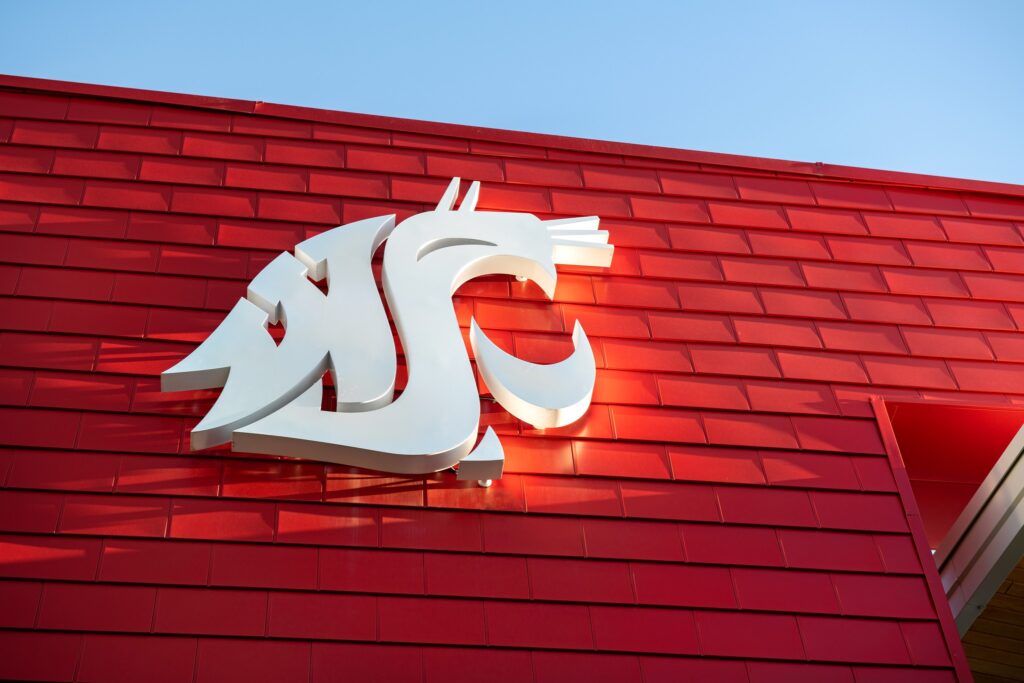 The cougar head emblem on the outside of a WSU Pullman building.