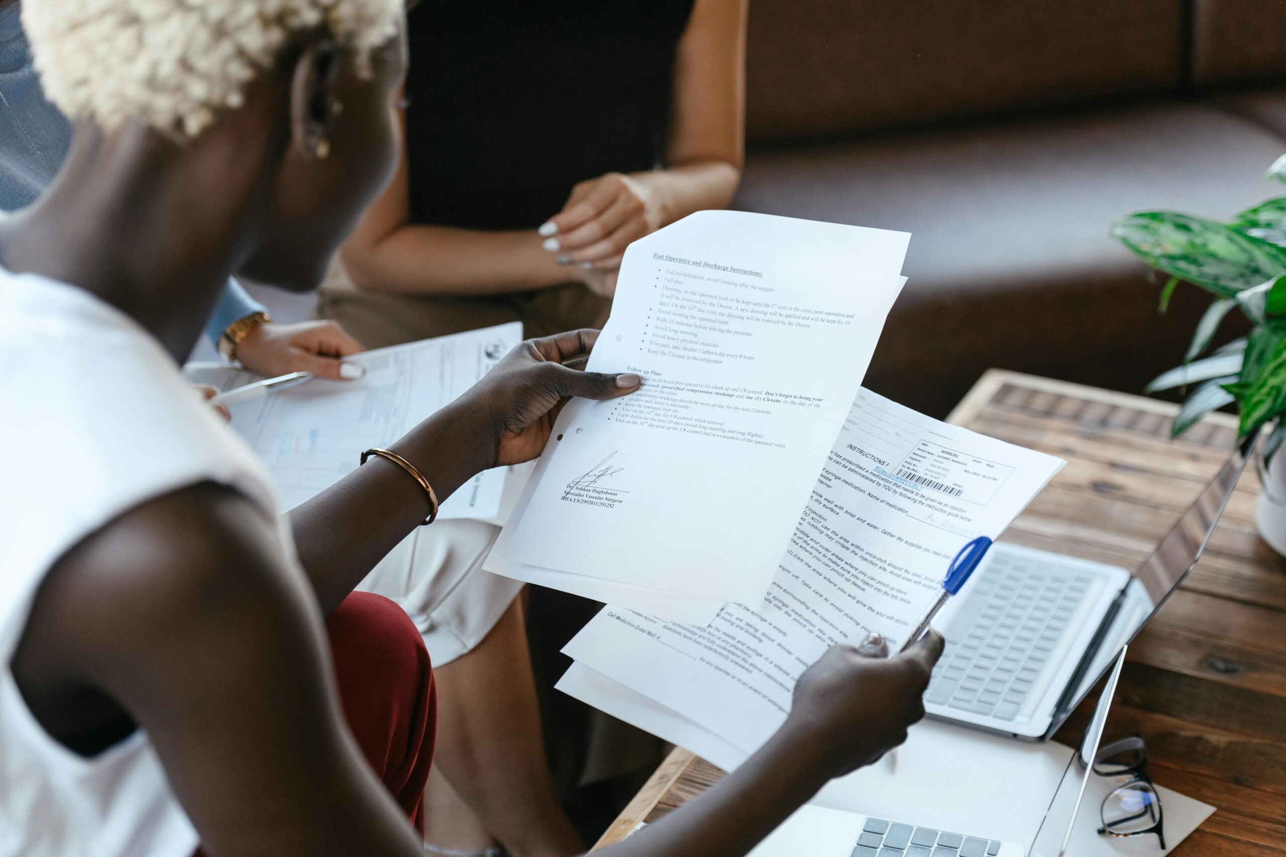 A woman compares two important documents.