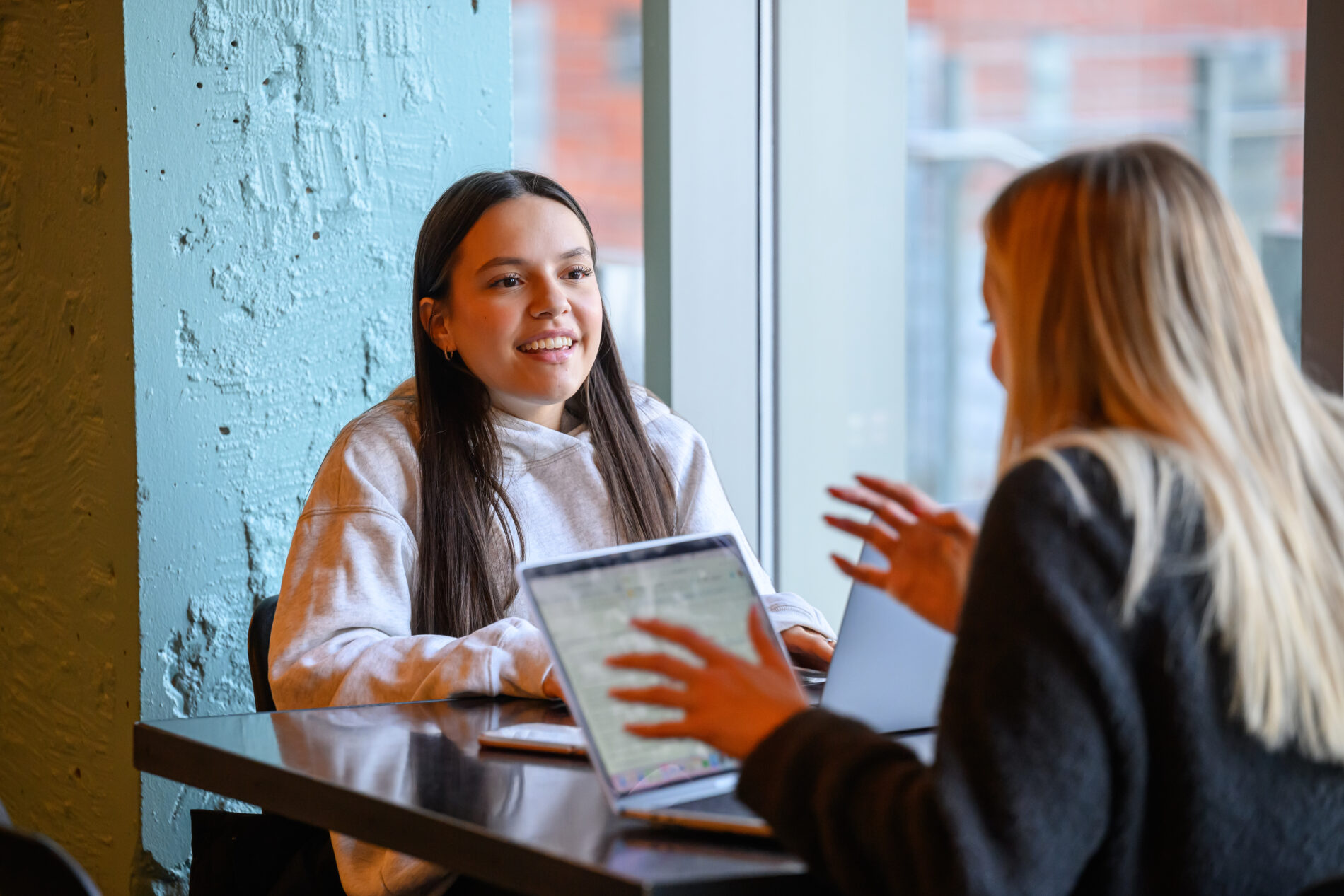 Two students discuss their work during WSU prep week.