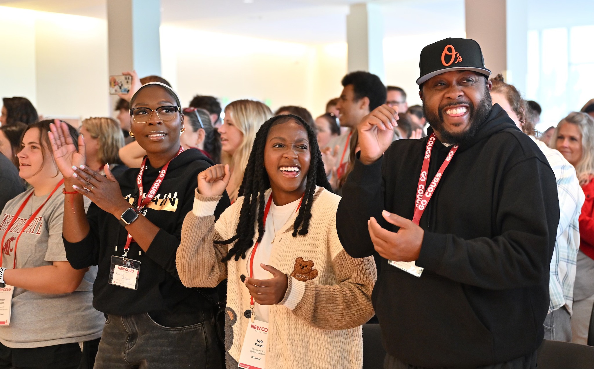 A family poses at New Coug Orientation.