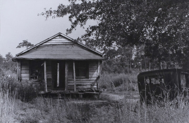 Robert Frank, Abandoned Car in Front of Yard of Old House, circa 1860