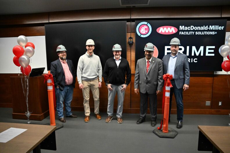 Jason B. Peschel, Rory Olson, Gus Simonds ’84, Dean Partha Pande, and Bob Ledford ’86 at the Prime Electric and MacDonald-Miller Carpenter Hall Classroom ribbon-cutting event