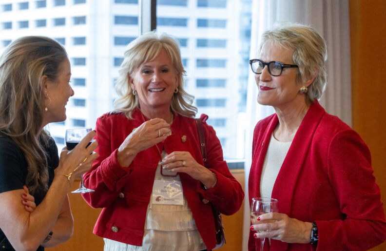WSU System President, Betsy Cantwell (right), pictured with fellow WSU community members at an event.