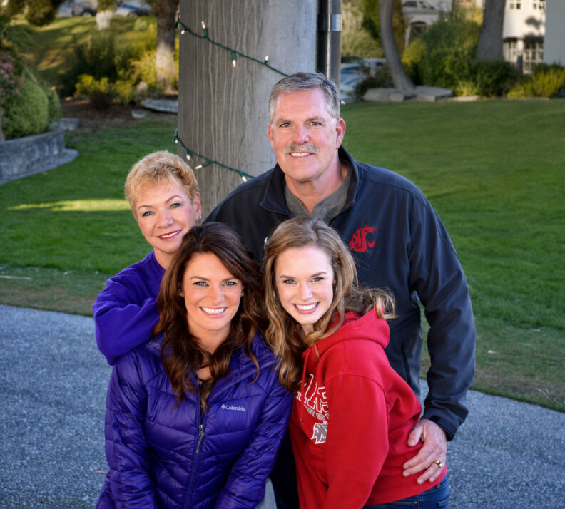 Brad Crollard poses outdoors with his wife, Christine, and daughters, Alysse and Michaela.