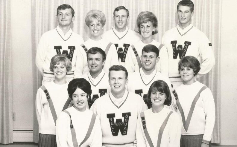 Black-and-white studio portrait of the 1966 Washington State University Yell Squad, showing 10 student members standing in three rows wearing matching WSU Yell Squad uniforms.