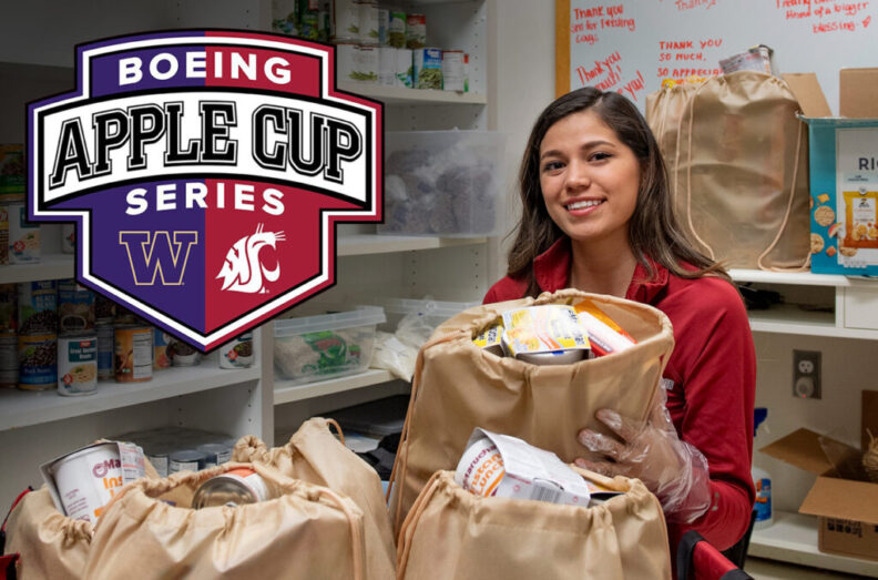 A student holds a bag full of shelf-stable food.