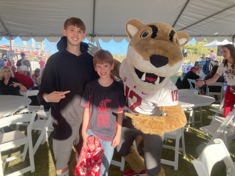 Andersen's children pose with Butch the Cougar