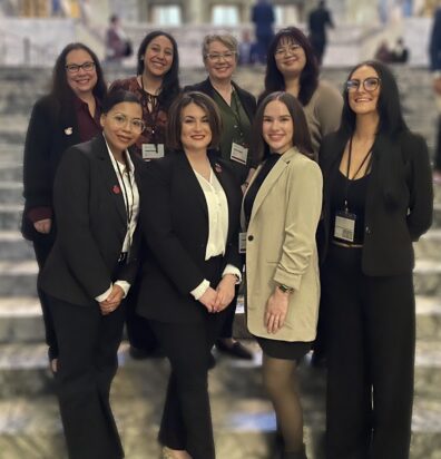 Small group of Washington State University Global Campus students posing inside the Washington State Capitol during Coug Day at the Capitol.