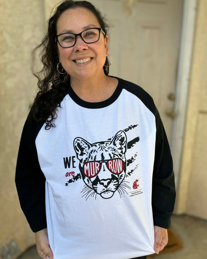 Example social media post. Photo of smiling woman posing while wearing a branded WSU Cougar t-shirt..