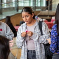 Untold Stories Event participant with raffle ticket