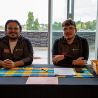 Untold Stories Event check in desk with two event staff members