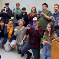 Photo: Students in General Virology class hold up their virus models created in the Spark Innovation Hub.