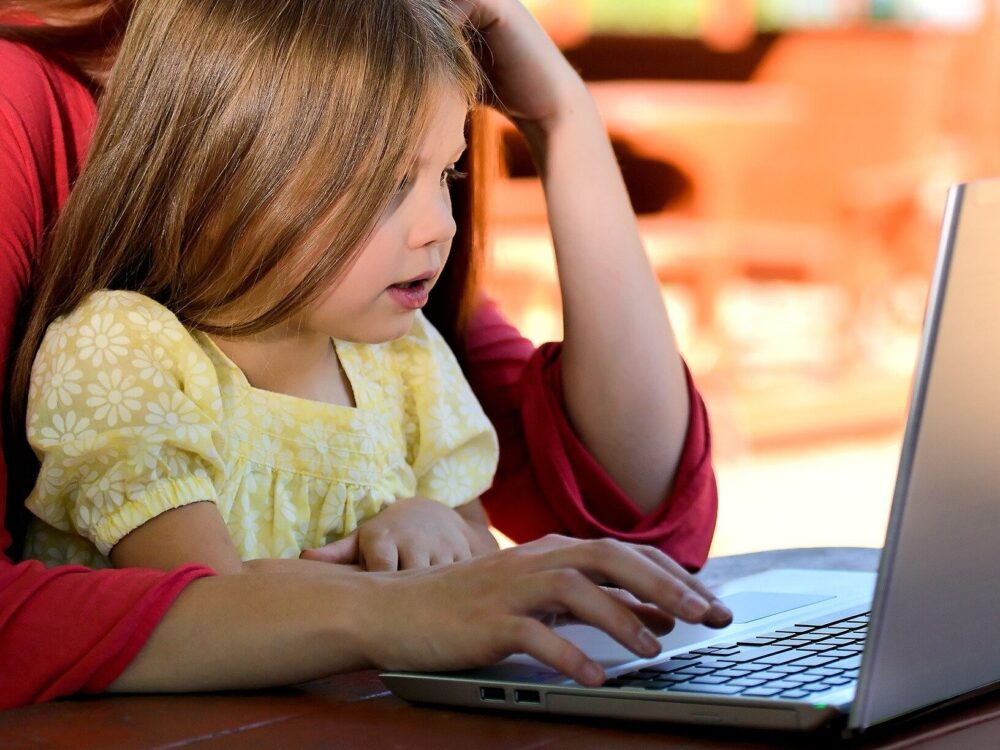 Child looking at a laptop