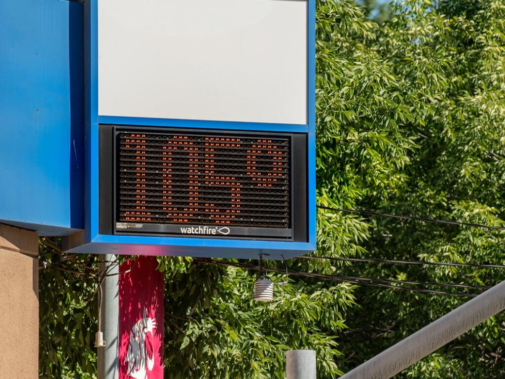 A digital sign showing the temperature as 105 degrees.