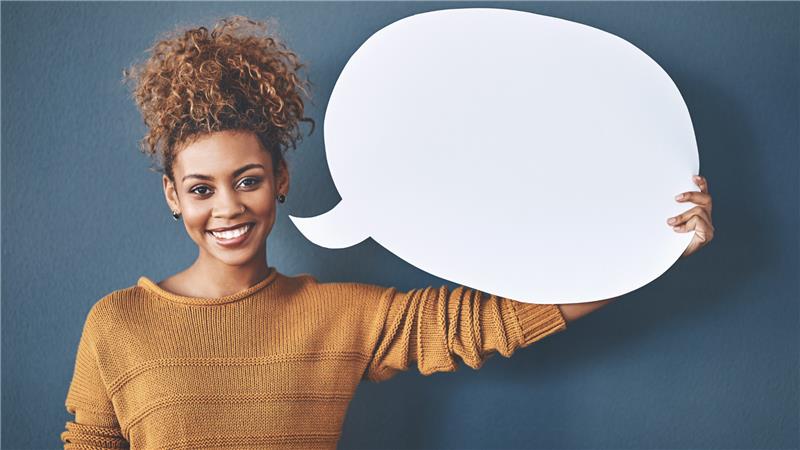 Person holding a conversation bubble.
