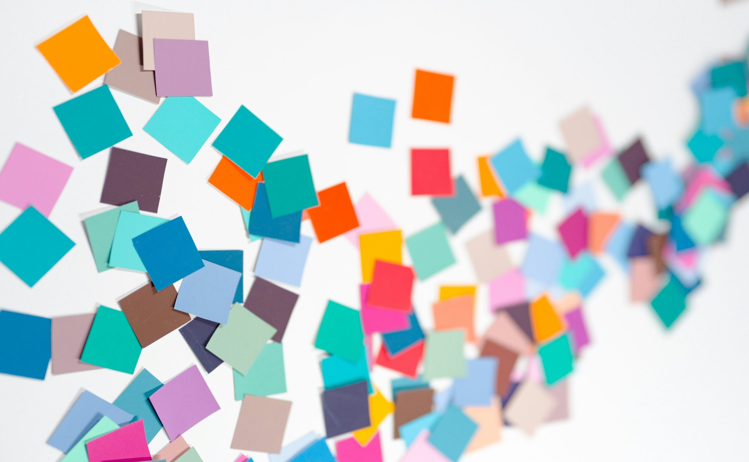 A wall of brightly colored post-it notes laid out like a wave.