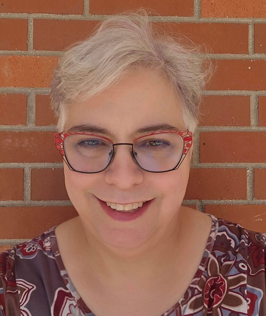 A photo of a woman smiling.
