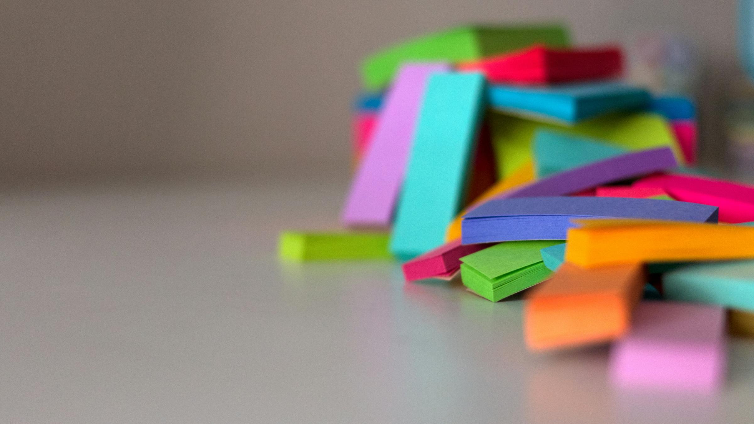 Sticks of brightly colored sticky notes.