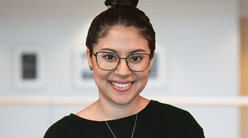 A photo of a woman smiling.