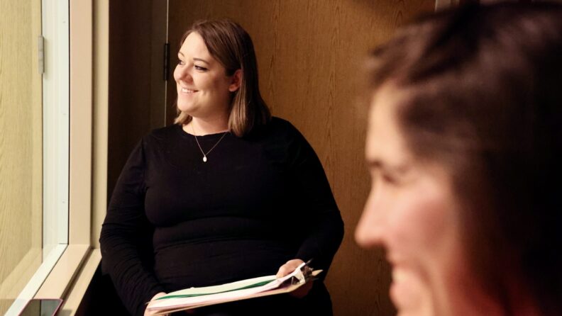 Clinical Communication coach Dr. Bradley observes simulation.