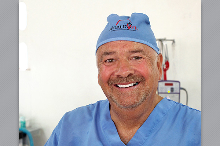 Dr. Brown wearing blue scrubs. Cap has a WordVets logo.