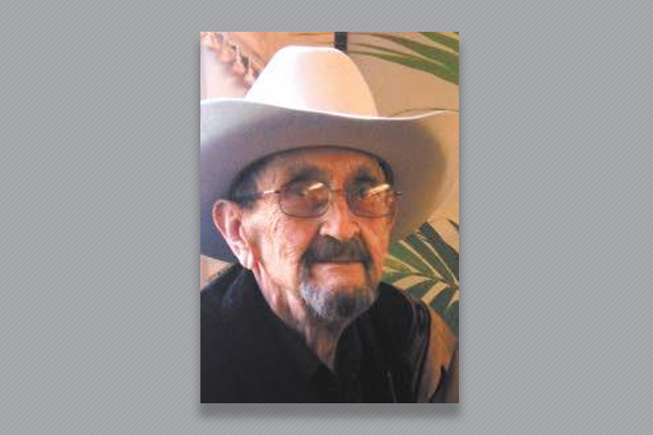 Dr. Butlter wearing a cream colored cowboy hat.