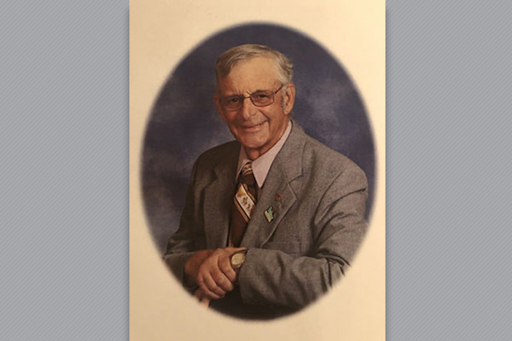 Dr. Curtis in a suit and tie.