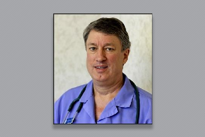 Dr. Hunter in purple scrubs.